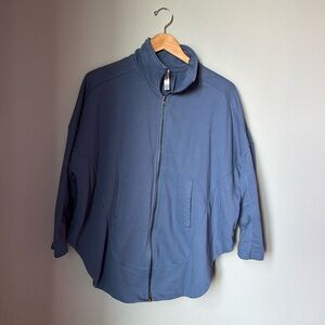 Small light blue jacket with drop sleeves, zipper closure off-line